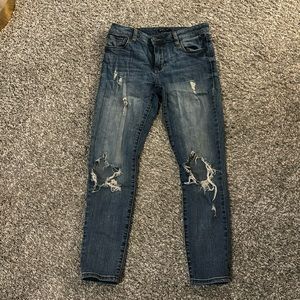 Distressed blue jeans